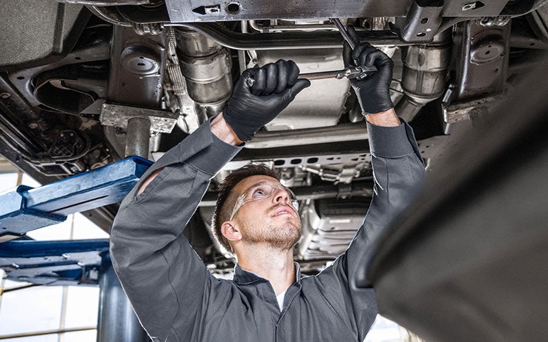 Service employee working on a car